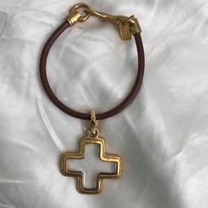 Coach leather bracelet with Cross Charm.